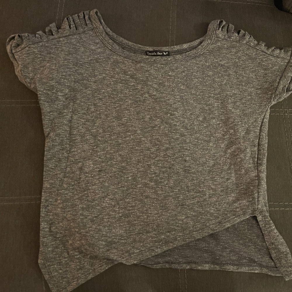Grey tee with slit sleeves.